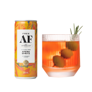 Alcohol-free aperol spritz can and glass with spritz on a white background