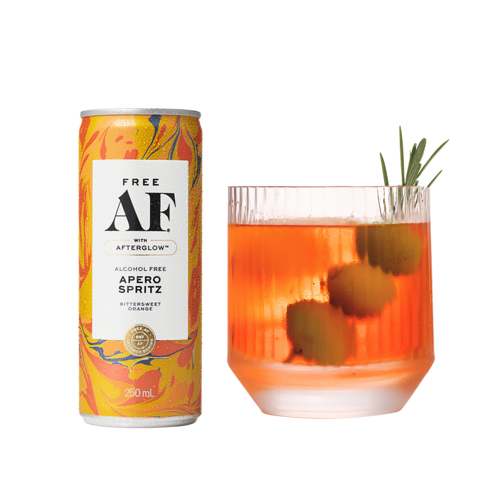 Alcohol-free aperol spritz can and glass with spritz on a white background
