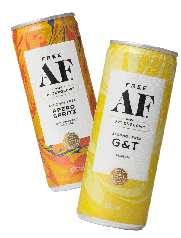 Two cans of alcohol-free drinks with colorful labels on a white background