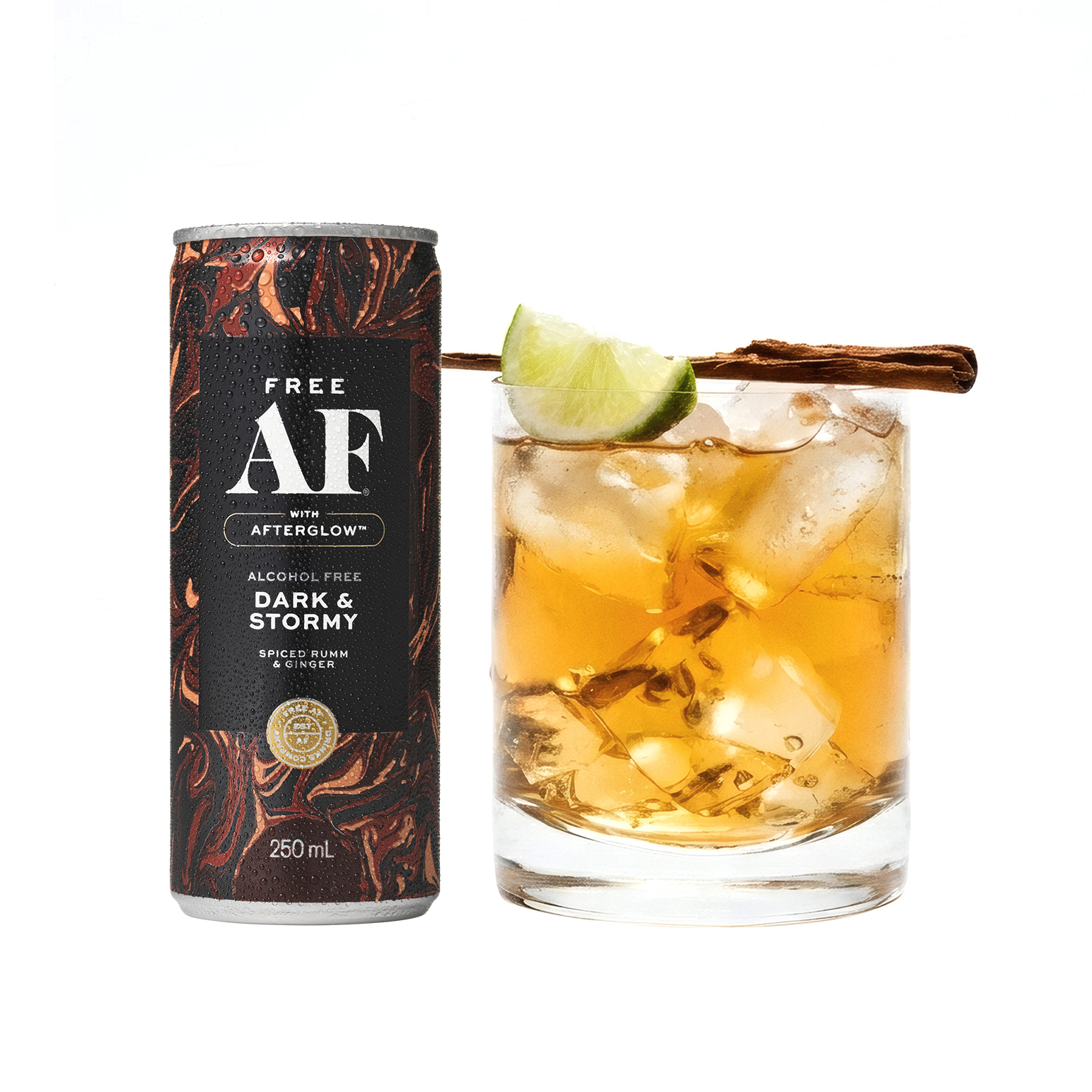 Alcohol-free Dark & Stormy drink can and glass with lime and cinnamon on a white background