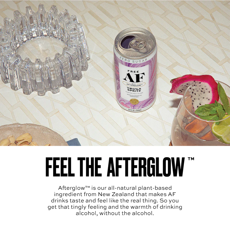 Can of AF drink with dragon fruit and lime on a textured surface, featuring 'Feel the Afterglow' text.